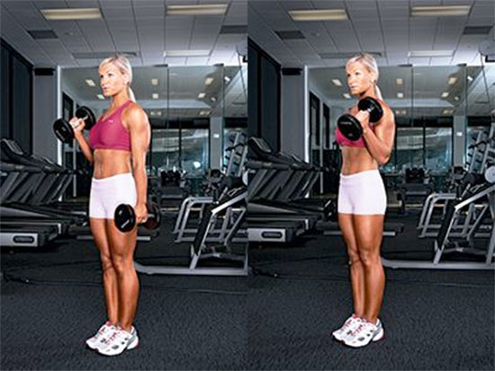 a girl performing alternate hammer curls in the gym