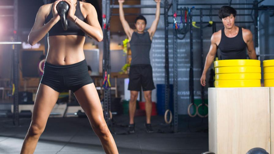 Beginner woman in the gym performing goblet squats