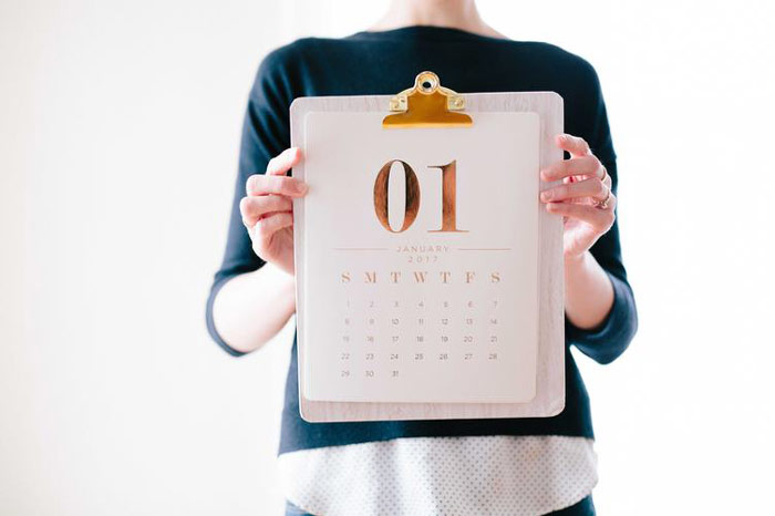 woman with calendar showing how perfect gym exercise buddies should have similar schedules