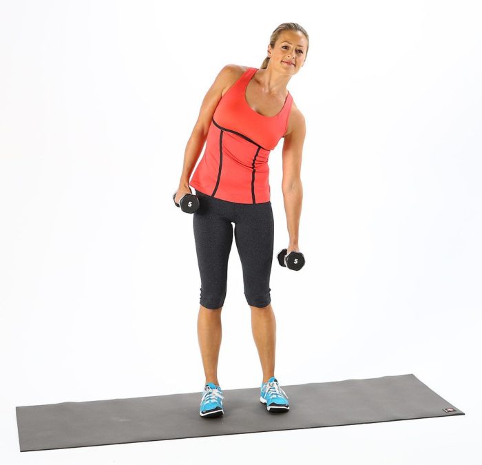 woman doing a dumbbell side bend