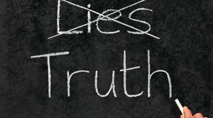 a chalk board with lies crossed out and the word truth written below