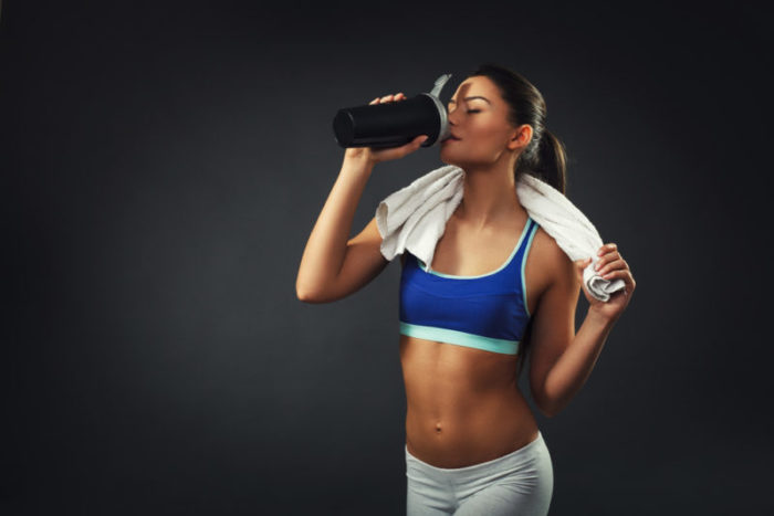 Woman taking a fat burner