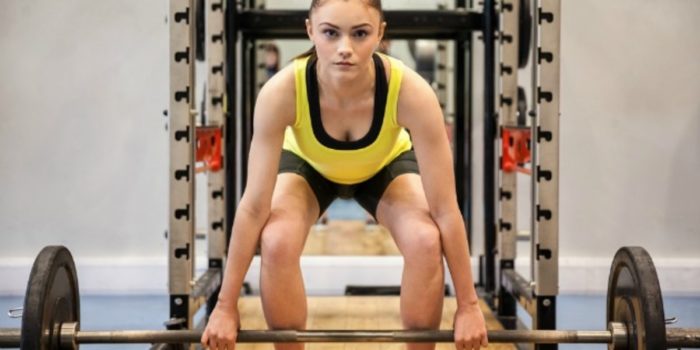 woman at the bottom of a deadlift