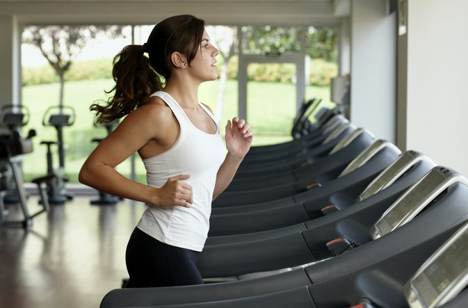 woman running on treadmill