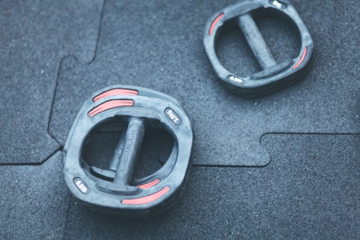 some weights on the floor of a home gym